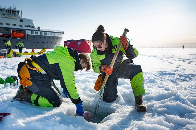 KPH_SeaIce_Christian_Morel.jpg Scientists working on the sea ice. Large research vessel in the background.